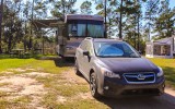 RV and car parked next to Lake Jasper in Hardeeville South Carolina