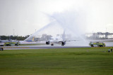 2014 - JetBlue A320-232 N709JB taxiing through the water cannon salute after being the first flight to land on 10R