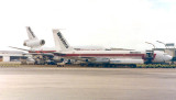 Western Airlines Boeing B720B and a McDonnell-Douglas DC10-10 on Concourse C at Miami International Airport