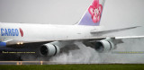 China Airlines Cargo B747-409F(SCD) B-18722 reversing thrust in the rain on runway 27 at MIA aviation cargo airline stock photo