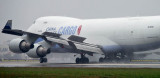 China Airlines Cargo B747-409F(SCD) B-18722 rolling out in the rain on wet runway 27 at MIA aviation cargo airline stock photo