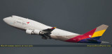 Asiana Cargo B747-48EBDSF HL7417 taking off from runway 26L at MIA into a storm front aviation airline stock photo
