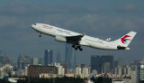 MU A-330 taking off with Shanghai skyline as the background, Nov 1 2016