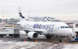 Finnair A-320 in OneWorld livery at a snowy HEL
