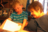 July 2012 - Kyler reading a book to grandma Karen
