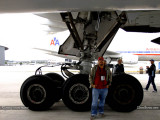 2013 MIA Airfield Tour - Carlos Bolado and the left main gear of American Airlines B777-223/ER N774AN
