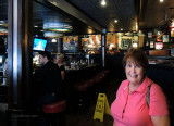 July 2014 - Karen at the spot inside Friday's at The Falls where we met 33 years before on July 3, 1981