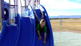 October 2014 - Kyler on the playground slide at Peterson Air Force Base