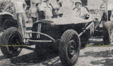 1949 - Dee Powell in his race car at the Opa-locka Speedway east of the blimp hangar