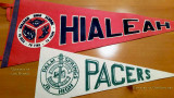 Pennants for the Palm Springs Junor High Pacers and Hialeah High Thoroughbreds
