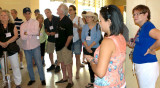 Hialeah High School Class of 1965 classmates being briefed before the tour of Hialeah High