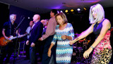 HHS-66 50-Year Reunion and Reunion of the 60s: classmates singing and dancing on stage with the band