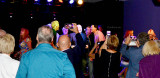 HHS-66 50-Year Reunion and Reunion of the 60s: classmates watching classmates singing and dancing on stage with the band