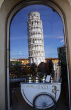 Tower of Pisa reflected in window of Gelataria, Pisa, Italy.
