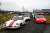Some of the cars that made up the 40-vehicle convoy, at second of 5 garages, on a horse farm (9650)