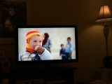 Syrian refugee child wearing handknit hat