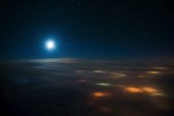 Chasing the moon over a cloudy Southern Russia two nights ago. Cities below the clouds pass by, billions of stars above us and t