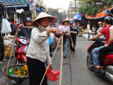 Street near the main market - Hanoi, Vietnam. Lots of traffic (cars, cycles of all kinds and people) on many streets in Hanoi.