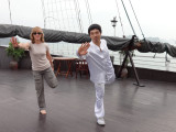 Fran learning Tai Chi aboard the Treasure Junk in Ha Long Bay, Vietnam