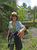 Judy showing the wrist band she made from a large palm tree leaf - on an island near My Tho in the Mekong Delta, Vietnam