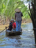 Our group in sampans exploring canals - an island near My Tho in the Mekong Delta, Vietnam