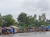 Floating village on the Mekong River - in Vietnam while traveling by boat from Chau Doc, Vietnam to Phnom Penh, Cambodia