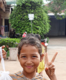 A young vendor at a service plaza - a few hours outside of Phnom Penh, Cambodia