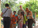 Sally, Fran and Alan talking to children while we stopped for lunch on our way to see our sponsored high school young ladies