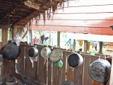 Hanging pans make up the kitchen area inside the house of one of our sponsored young ladies (high school student)