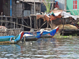 Houses (on stilts/piles) and boats in a stilted village on Tonle Sap Lake in the Siem Reap Province of Cambodia