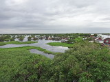 Floating village in the flooded forest/wetlands next to Tonle Sap Lake - Siem Reap Province, Cambodia