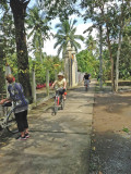 Helen and Stan on bikes with Janet beside hers on a trail on an island near My Tho, Vietnam