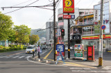 Street corner near the Nunohan Hotel and Lake Suwa in Suwa-shi - traffic flows on opposite sides of street compared to U.S.