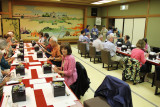 Judy and the group at a traditional Japanese dinner consisting of many courses of small portions in wooden boxes - in  Kanazawa