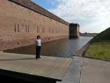 Judy on the drawbridge entrance over a moat - at Fort Pulaski on Cockspur Island between Tybee Island and Savannah