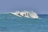 surfers at Kekaha Kai bay