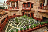 WOMAN IN THE COURT YARD OF THE ISKCON TEMPLE.