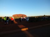 A lineup of sundowners waiting for sunset - the shadows are all the buses parked there