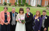 bride and groom with parents