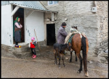 A family man preparing the horses