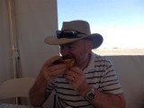 Wayne eating a famous Farina Bakery pie