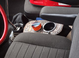 An Old License Plate Made Into A Cup Holder And Ash Tray