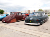 A 49 Ford, Lowered And With Skirts And Its Older Brother...