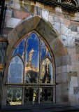 Reflections on window of pinnacles and statue .. 3629