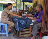 playing cards while waiting for customers