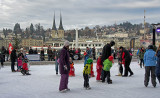 Ice skating, ship and town Lucerne
