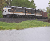Eastbound 956 passes Lake Wells during a hard downpour