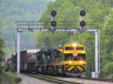 Virginian 1069 brings Northbound 142 under the signal bridge at Southfork KY 