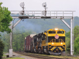 NS 142 smokes it up under the Northbound signal bridge at Palm
