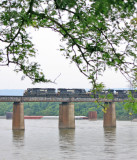 A steady rain is falling as M-17 crosses the Tennessee River after a long trip South 